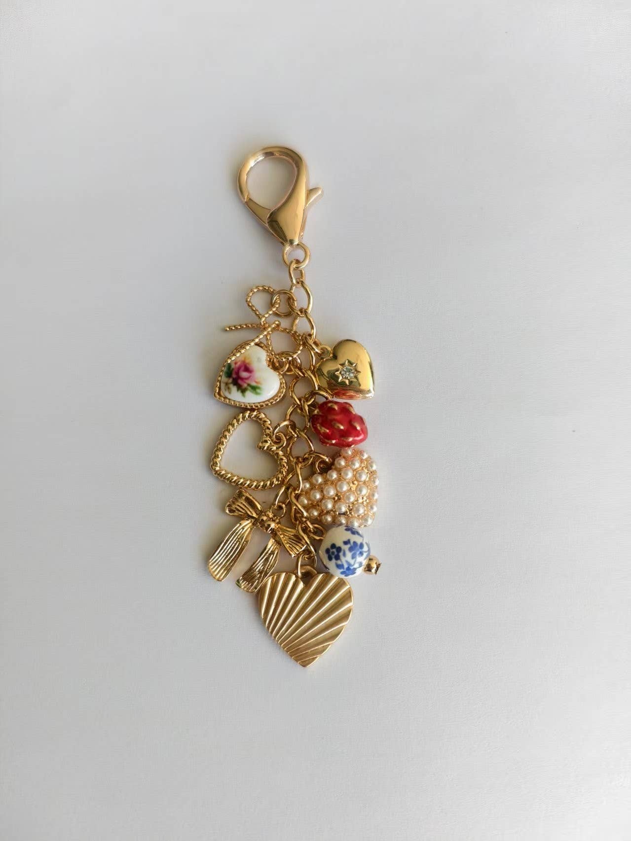PORCELAIN BOWS HEARTS PEARL STRAWBERRY BAG CHARM |